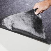 Adhesive-backed non-slip absorbent floor mat