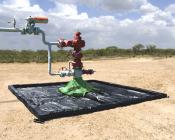 Wellhead Berm Prevents Soil Contamination