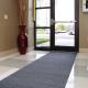 Adhesive-backed absorbent entrance mat