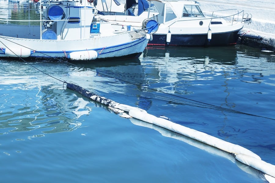 absorbent containment boom in marina oil spill