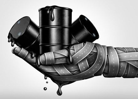 a hand made of roads holding oil barrels illustration