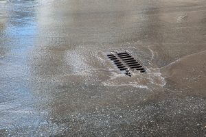 water running into a storm water drain