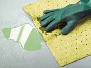 Using a chemical absorbent pad for spill cleanup