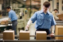 worker standing on the assembly line