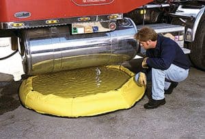 Spill berm under a truck