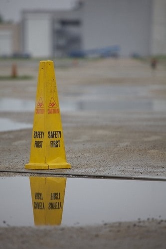 caution safety sign near a puddle