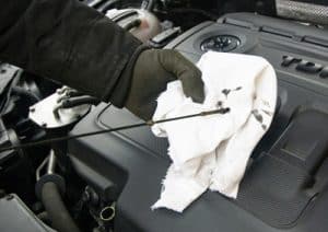 Oily rag and car oil dipstick 