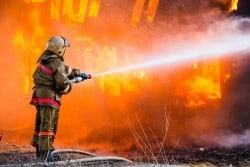 firefighter at industrial fire