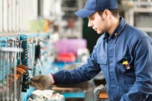 worker selecting a tool from a workstation