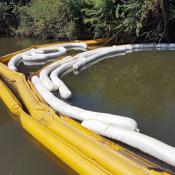 Absorbent and containment booms on water