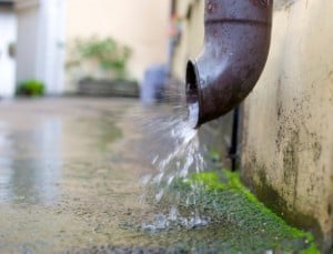 gutter down pipe spilling water