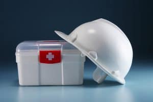 first aid kit and construction hard hat