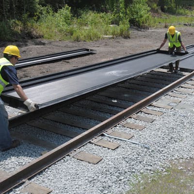 How Track Pans Compare to Other Containment Solutions
